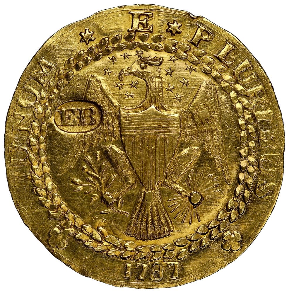 A 1787 Brasher doubloon with the EB counterstamp on the eagle's wing — the MS63 example sold at auction Auctions in January 2014, not the Partrick specimen the FLOAT constituent is priced on.