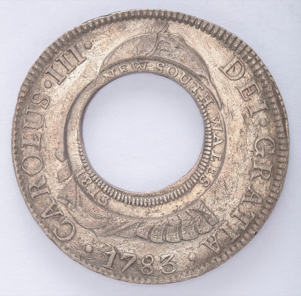1813 New South Wales Holey Dollar, side with the NEW SOUTH WALES 1813 counterstamp around the hole in a 1783 Spanish dollar — the State Library of New South Wales' example of the same issue; the constituent tracks the issue generally